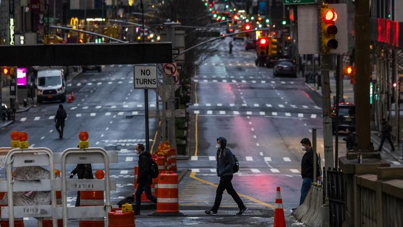 NEW YORK, NY - MARCH 27: People cross Park Av. after it was announced that some streets will be shut as lockdown continues in response to the coronavirus (COVID-19) outbreakon March 27, 2020 in New York City. Mayor Bill de Blasio chose four streets across four boroughs to test whether shutting down streets to vehicular traffic would increase social distancing among pedestrians during the COVID-19 pandemic shutdown.