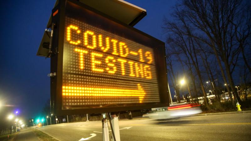 A sign directing drivers to a coronavirus testing site