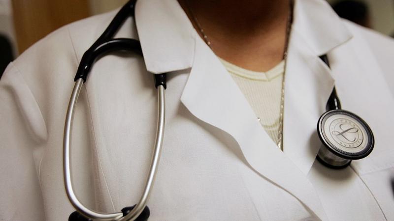 Physician assistant wearing a stethoscope in in 2006