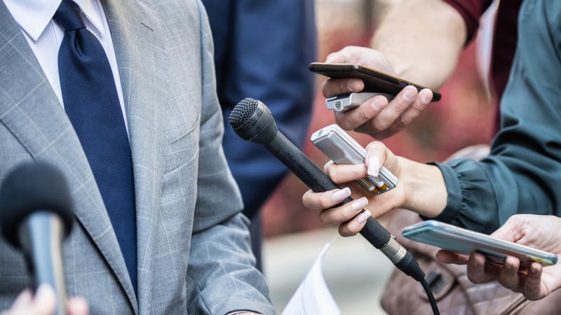 Journalists interviewing a source