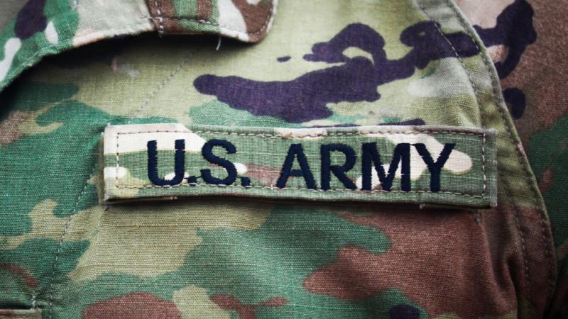 Army badge on soldier's uniform in August 2020