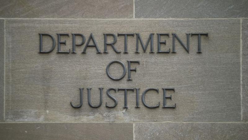 Justice Department sign in Washington DC in 2019