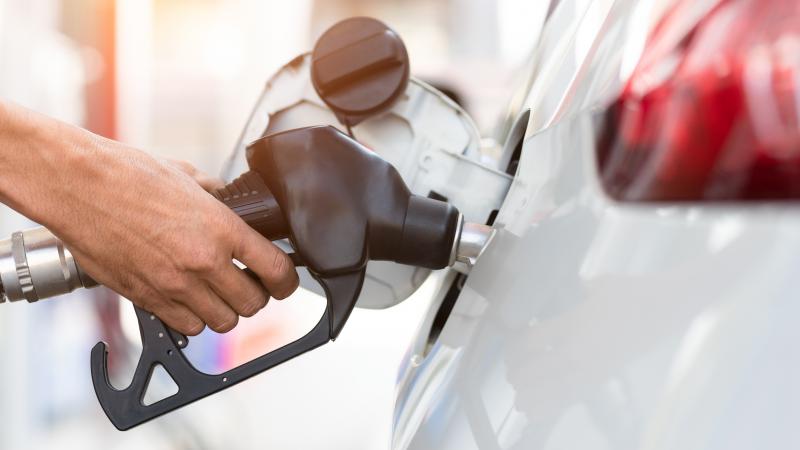 Someone pumping gas
