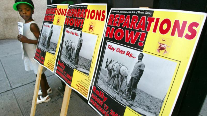 Signage at a pro-reparations protest in 2002