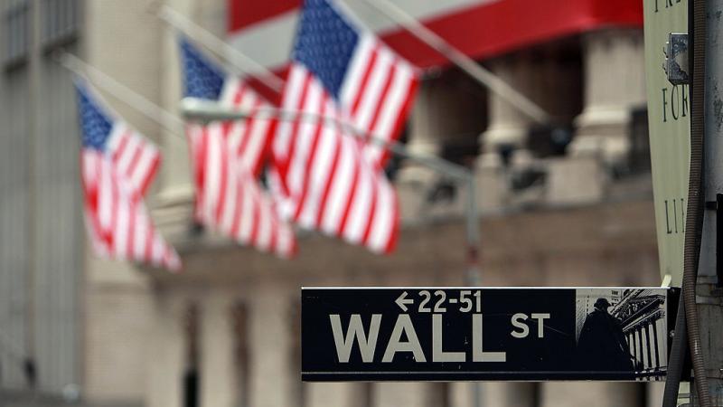 Wall Street sign next to the New York Stock Exchange in 2008