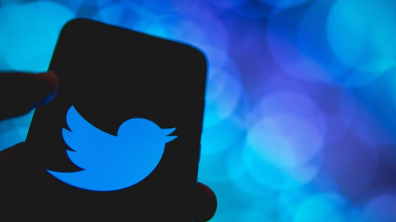 Photo illustration in which Twitter logo is displayed on phone screen in Greece on April 14, 2021