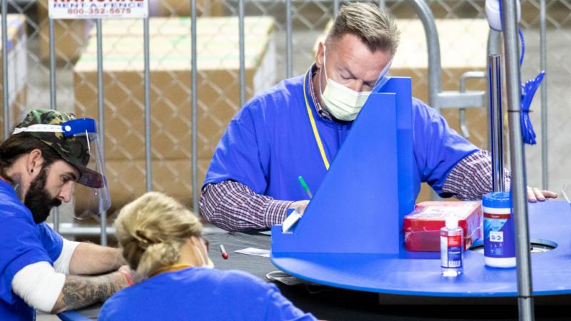 Audit workers in Phoenix, Az., May 1