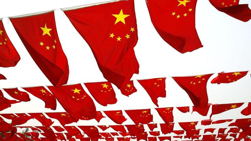 Chinese people visit a national flag show in China in 2006