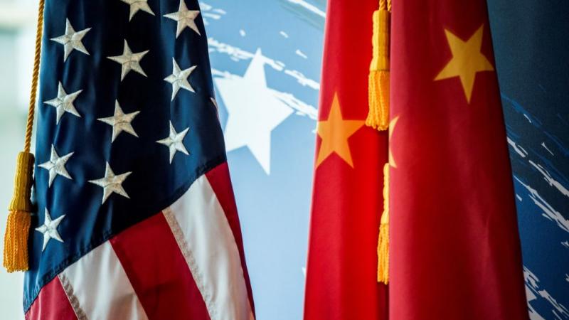 Chinese and American flag at event in Beijing in June 2017