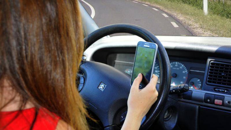 Driver with phone.
