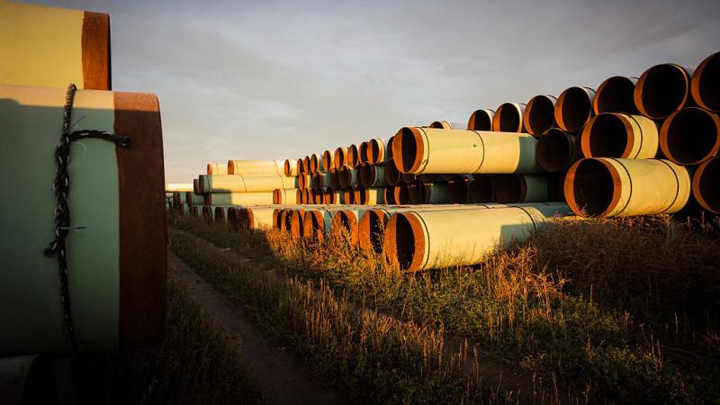 Pipe prepared for the Keystone XL Pipeline sitting in a lot outside Gascoyne, North Dakota in 2014