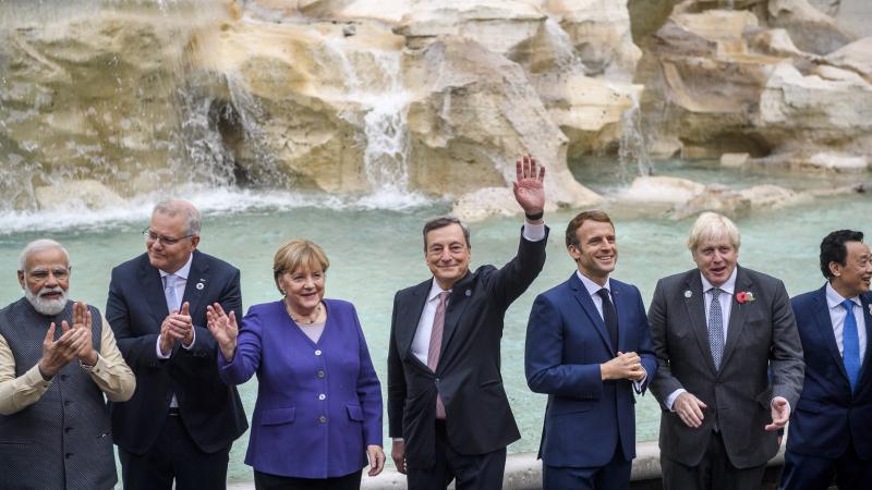 Indian Prime Minister Narendra Modi, Prime Minister of Australia Scott Morrison, German chancellor Angela Merkel, Italian Prime Minister Mario Draghi, French president Emmanuel Macron, British Prime Minister Boris Johnson, Director general, Food and Agriculture Organization (FAO), Qu Dongyu visit the Trevi fountain on the second day of the Rome G20 Summit, on October 31, 2021 in Rome, Italy.