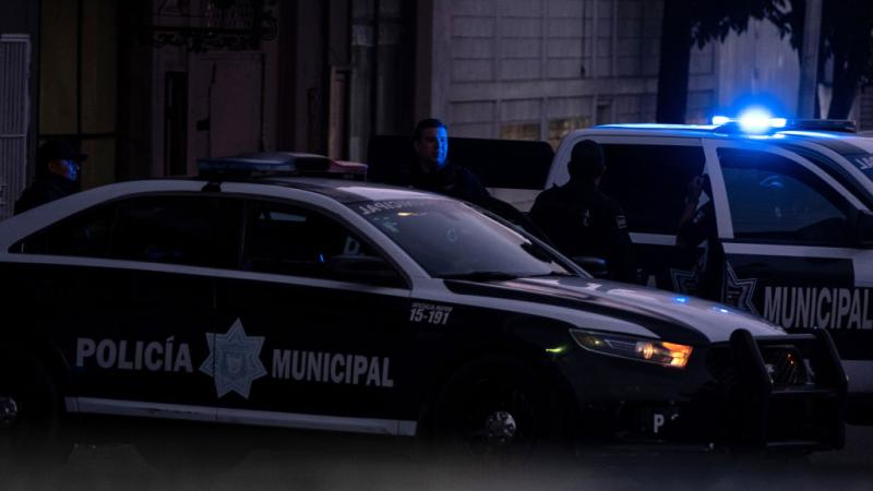 Police guard a Cartel crime scene in Baja, 2019