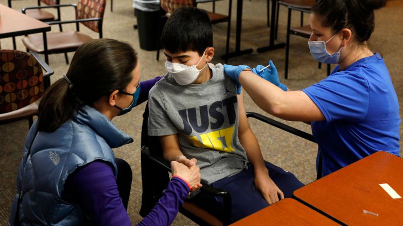 Child receives COVID vaccine, Michigan, May 10, 2021