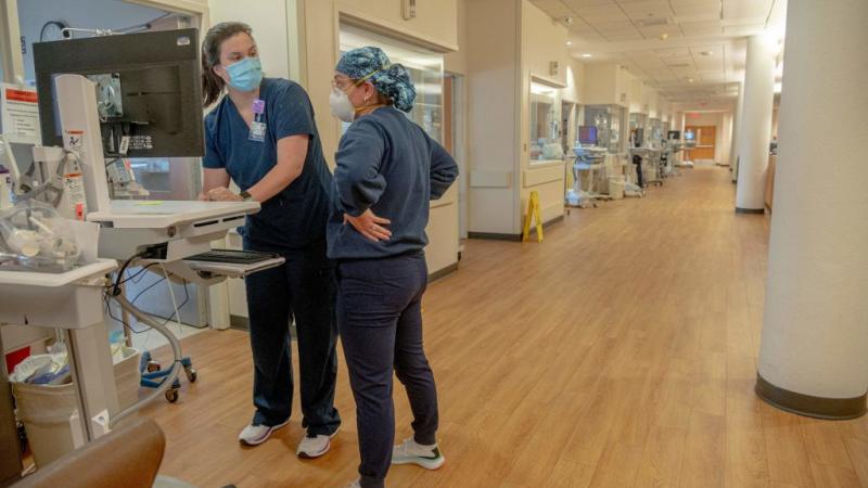Hospital workers wear masks, August 2021