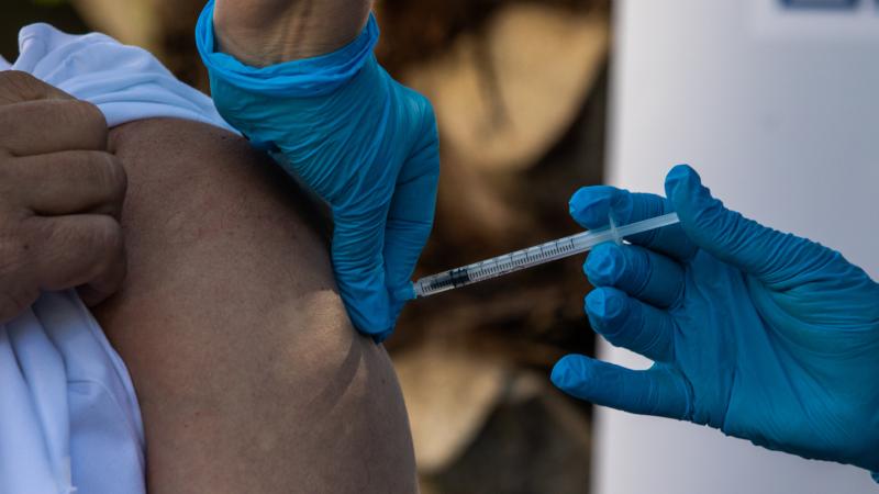Administering a COIVID vaccine