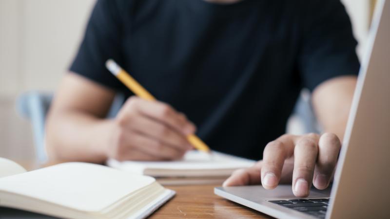 Man on computer taking test