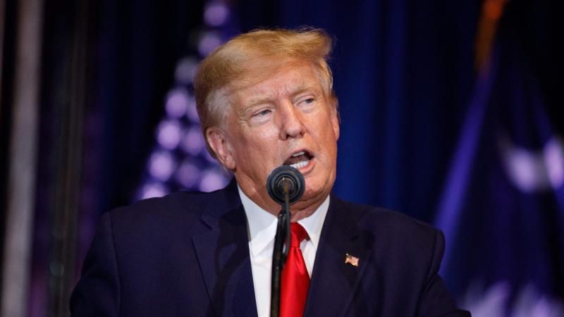 Donald Trump speaks at podium