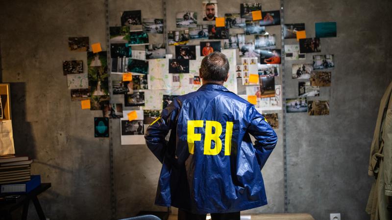 FBI agent examining evidence 