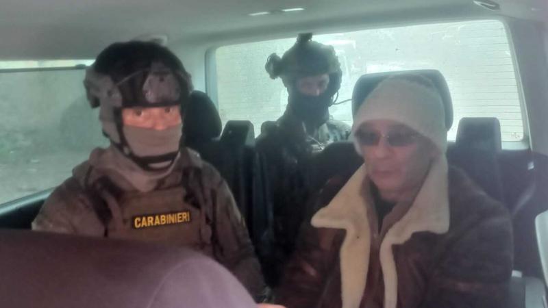 In this handout image provided by the Carabinieri, Matteo Messina Denaro is transported in a van after he was arrested In Sicily, on January 16, 2023 in Palermo, Italy.