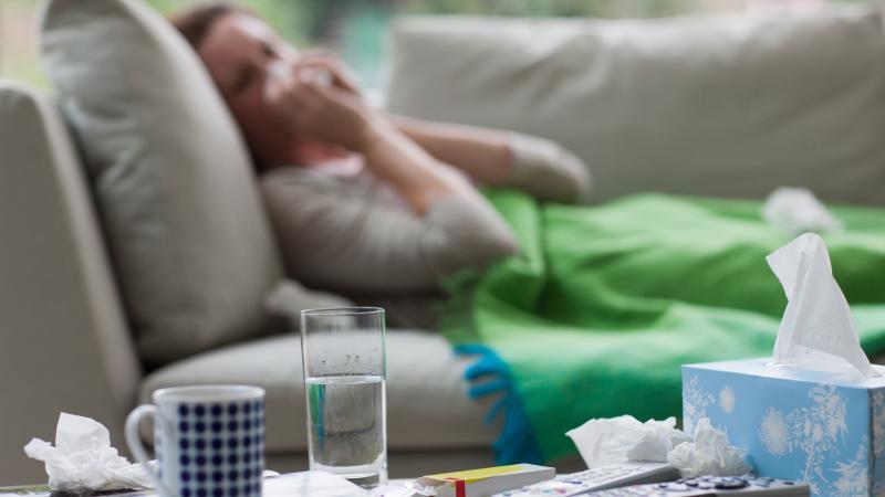Sick woman, cold, file photo