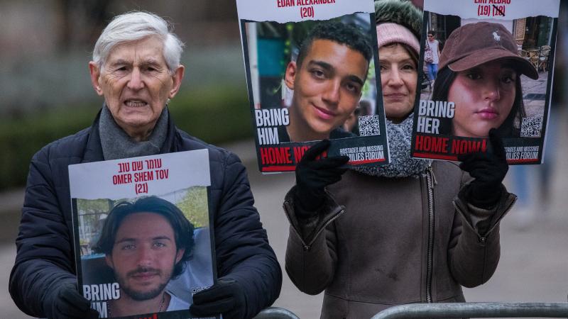 Families show photos of hostages still held by Hamas