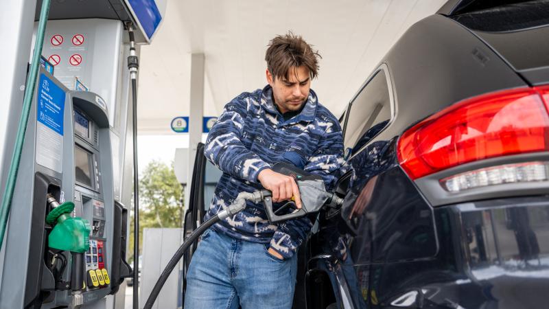 man at gas pump