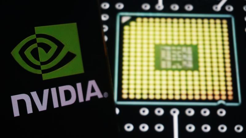 A staged photo of the logo of chipmaker nVidia and circuit board