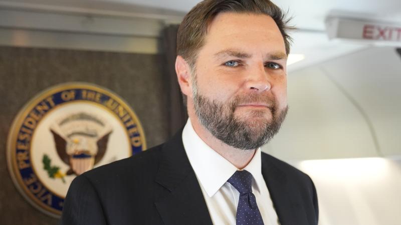 U.S. Vice President JD Vance talks to reporters on board Air Force Two at Leonardo da Vinci International Airport on May 19, 2025 in Rome, Italy.