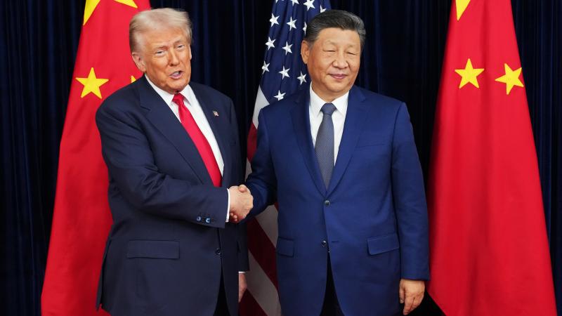 U.S. President Donald Trump greets Chinese President Xi Jinping ahead of a bilateral meeting at Gimhae Air Base on October 30, 2025 in Busan, South Korea