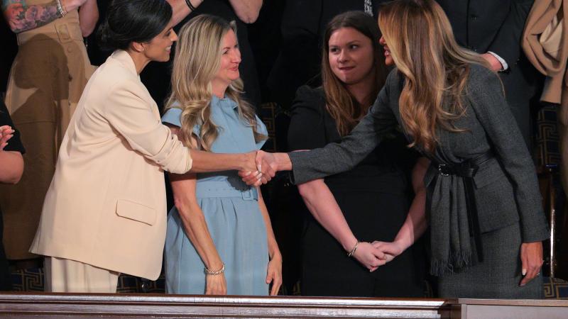 First Lady Melania Trump shakes the hand of Second Lady Usha Vance ahead of U.S. President Donald Trump's address to a joint session of Congress at the U.S. Capitol on March 04, 2025 in Washington, DC.