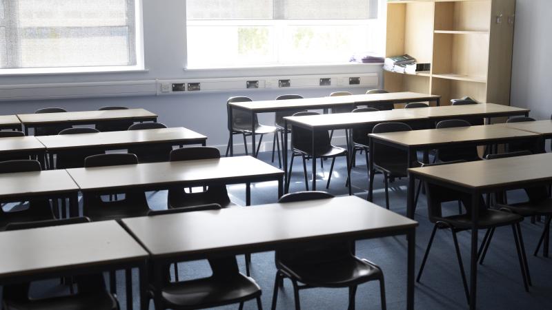 An empty high school classroom ready for students to arrive.