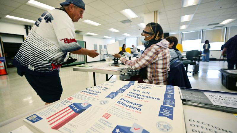 Voter checks in at polling location in Norwalk, California 
