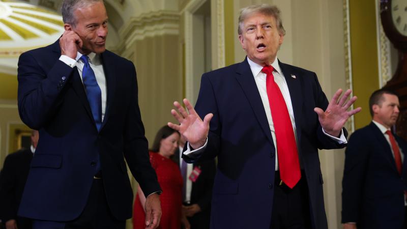 U.S. Senate Majority Leader John Thune watches as President Donald Trump speaks to the media at the U.S. Capitol on June 24 in Washington, D.C.