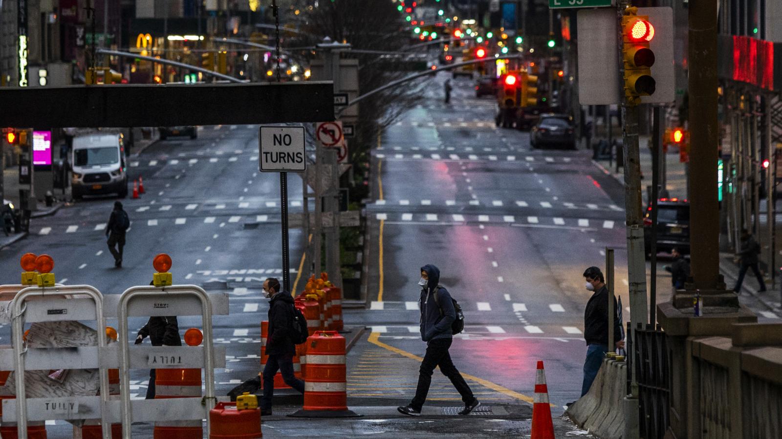 NEW YORK, NY - MARCH 27: People cross Park Av. after it was announced that some streets will be shut as lockdown continues in response to the coronavirus (COVID-19) outbreakon March 27, 2020 in New York City. Mayor Bill de Blasio chose four streets across four boroughs to test whether shutting down streets to vehicular traffic would increase social distancing among pedestrians during the COVID-19 pandemic shutdown.