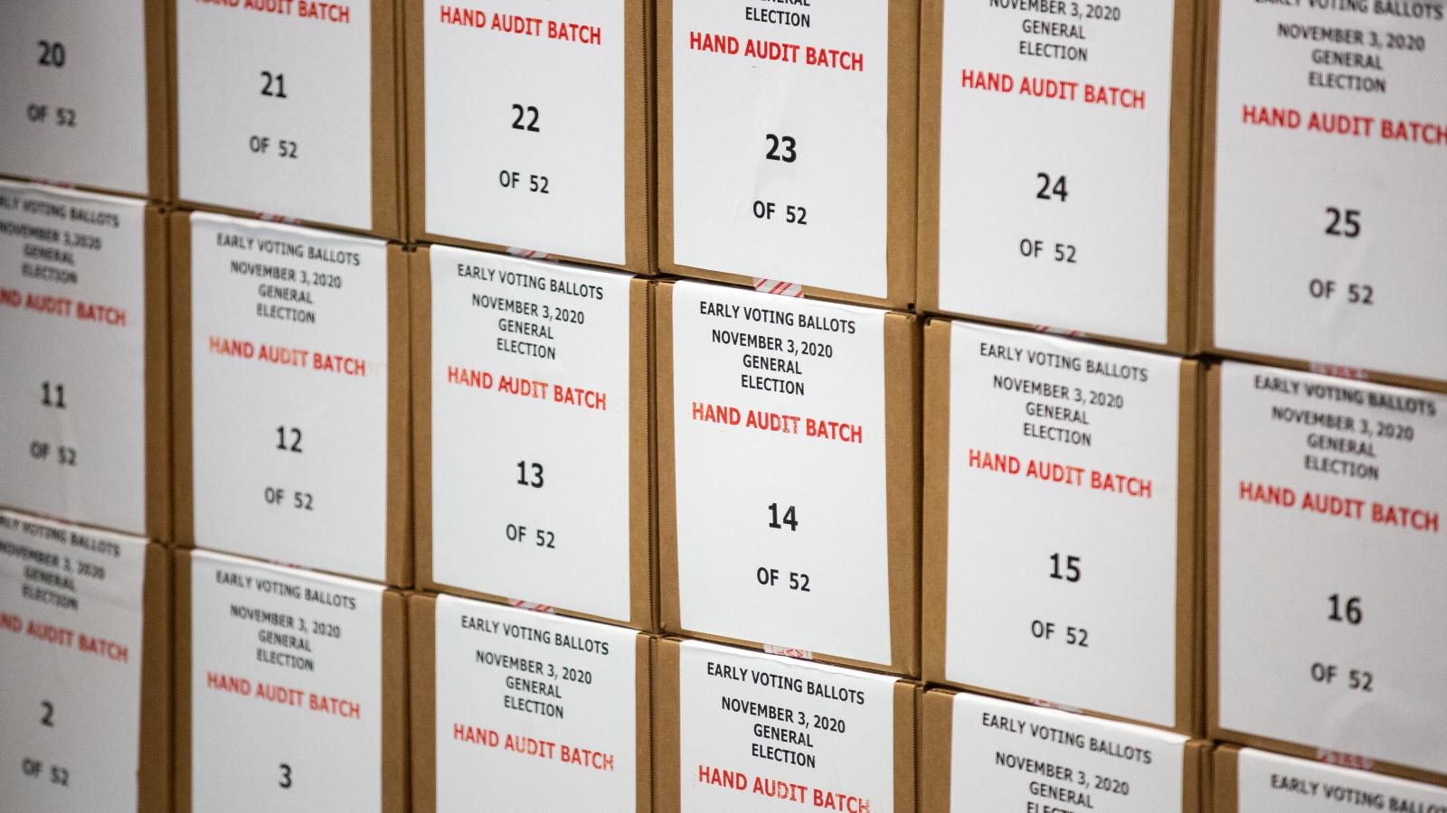 Ballots are pulled aside for a hand audit by Maricopa County Elections Department staff ahead of Tuesdays election on October 31, 2020 in Phoenix, Arizona.