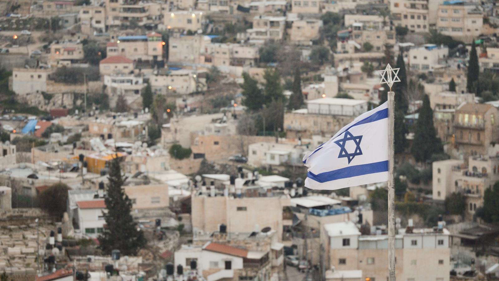 An Israeli national flag seen from Mount of Olives in Jerusalem. On Tuesday, February 4, 2020, in Jerusalem, Israel.