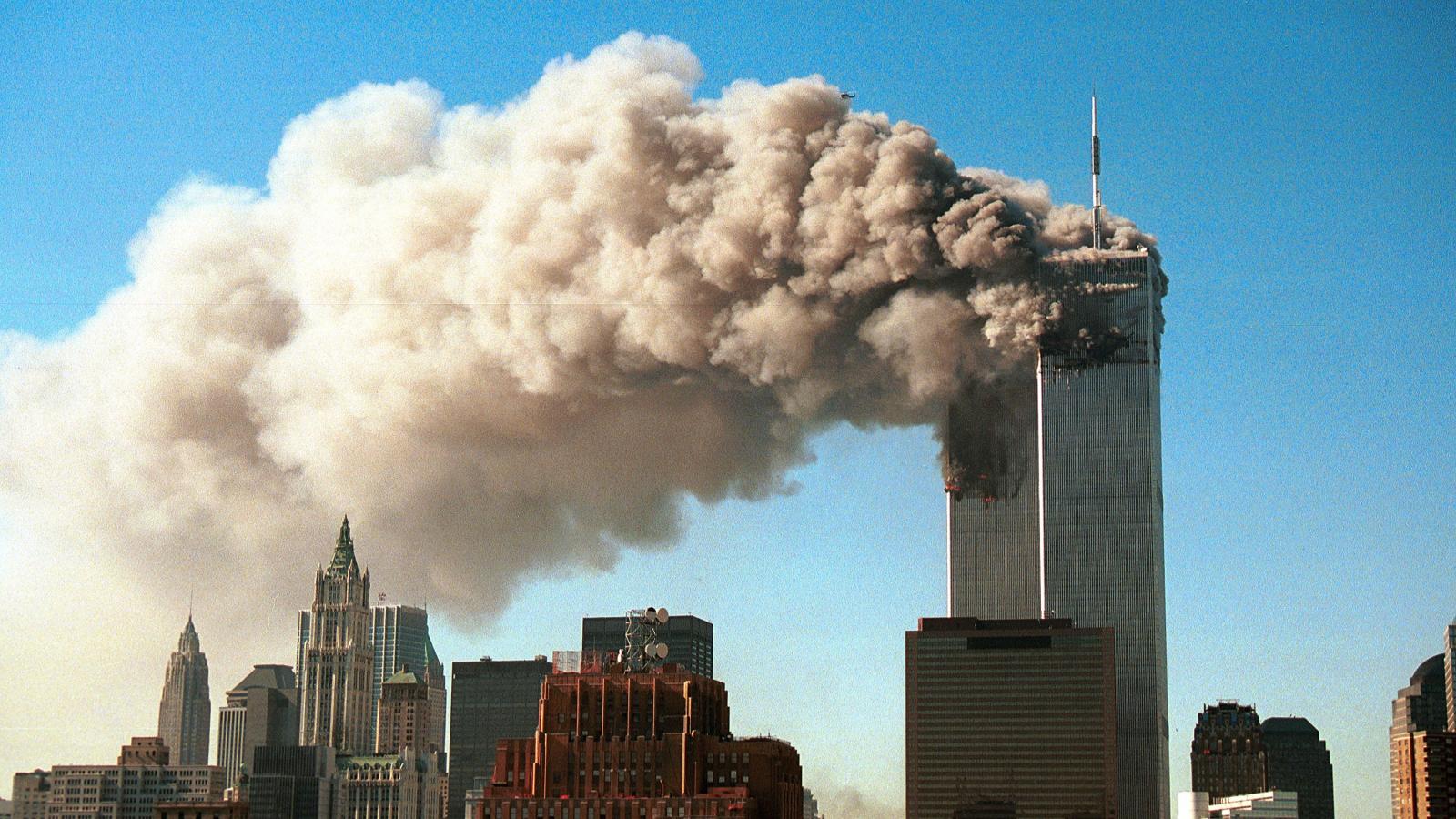 Smoke pours from the twin towers of the World Trade Center after they were hit by two hijacked airliners in a terrorist attack September 11, 2001 in New York City.