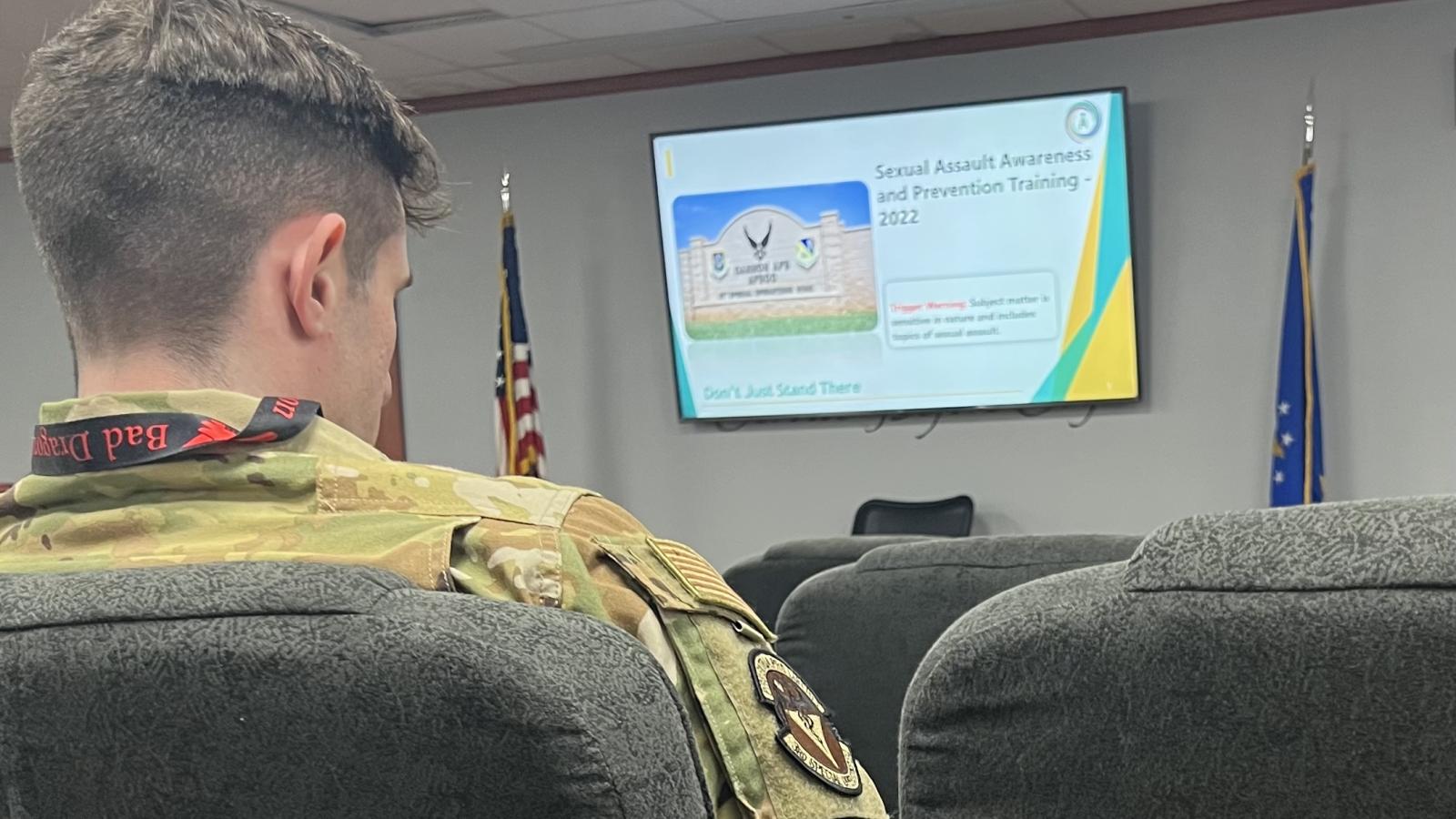 Service member wearing Bad Dragon lanyard during sexual harassment training