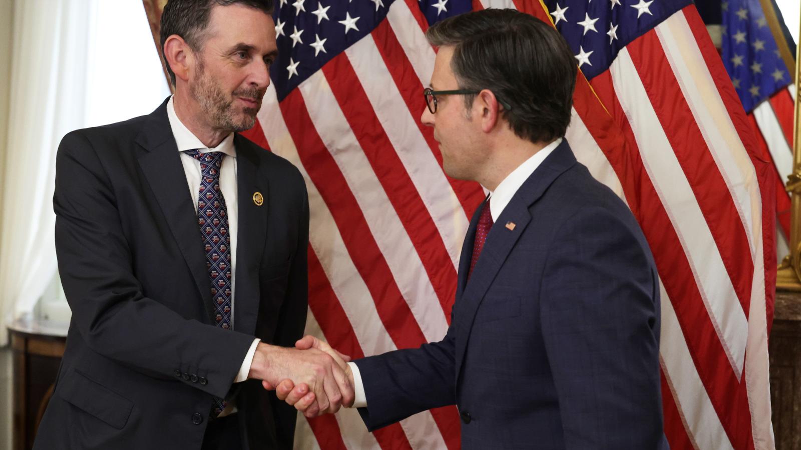 U.S. Speaker of the House Rep. Mike Johnson (R-LA) (R) shakes hands with Rep. Michael Rulli (R-OH) (L) during a ceremonial swearing-in at the U.S. Capitol on June 25, 2024 in Washington, DC. Speaker Johnson held a mock swearing-in for the newest member from Ohio