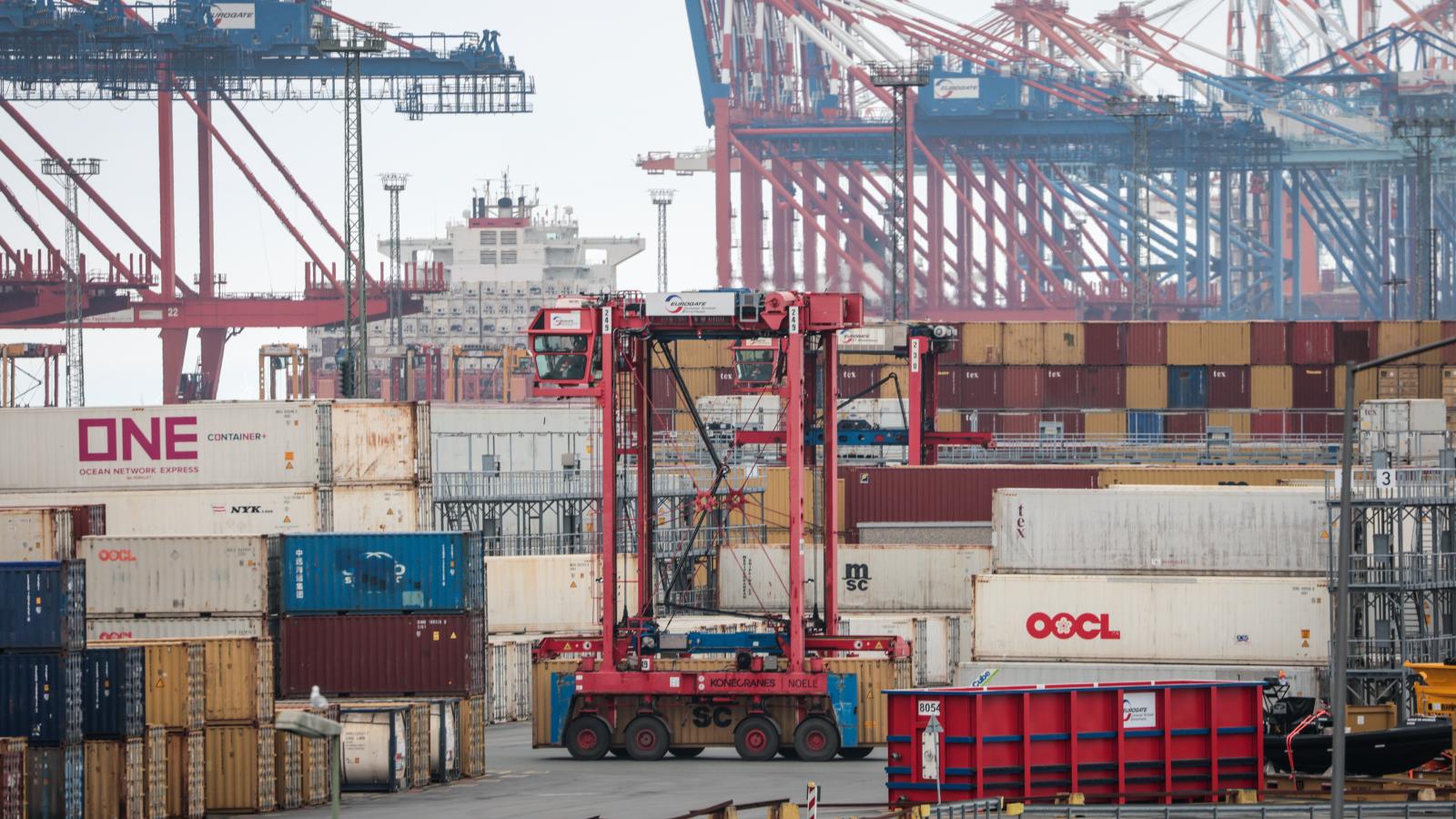 A van carrier of terminal operator Eurogate passes between stacked containers at the container terminal of Bremerhaven port on April 22, 2025 in Bremerhaven, Germany. Industry and logistics are facing continued uncertainty over the tariffs policy of U.S. President Donald Trump. While Trump has imposed a 25% tariff on European cars and auto parts imports, he has also suggested he may rescind these tariffs in some form. He said too he expects to reach a "deal" with the EU over tariffs soon.